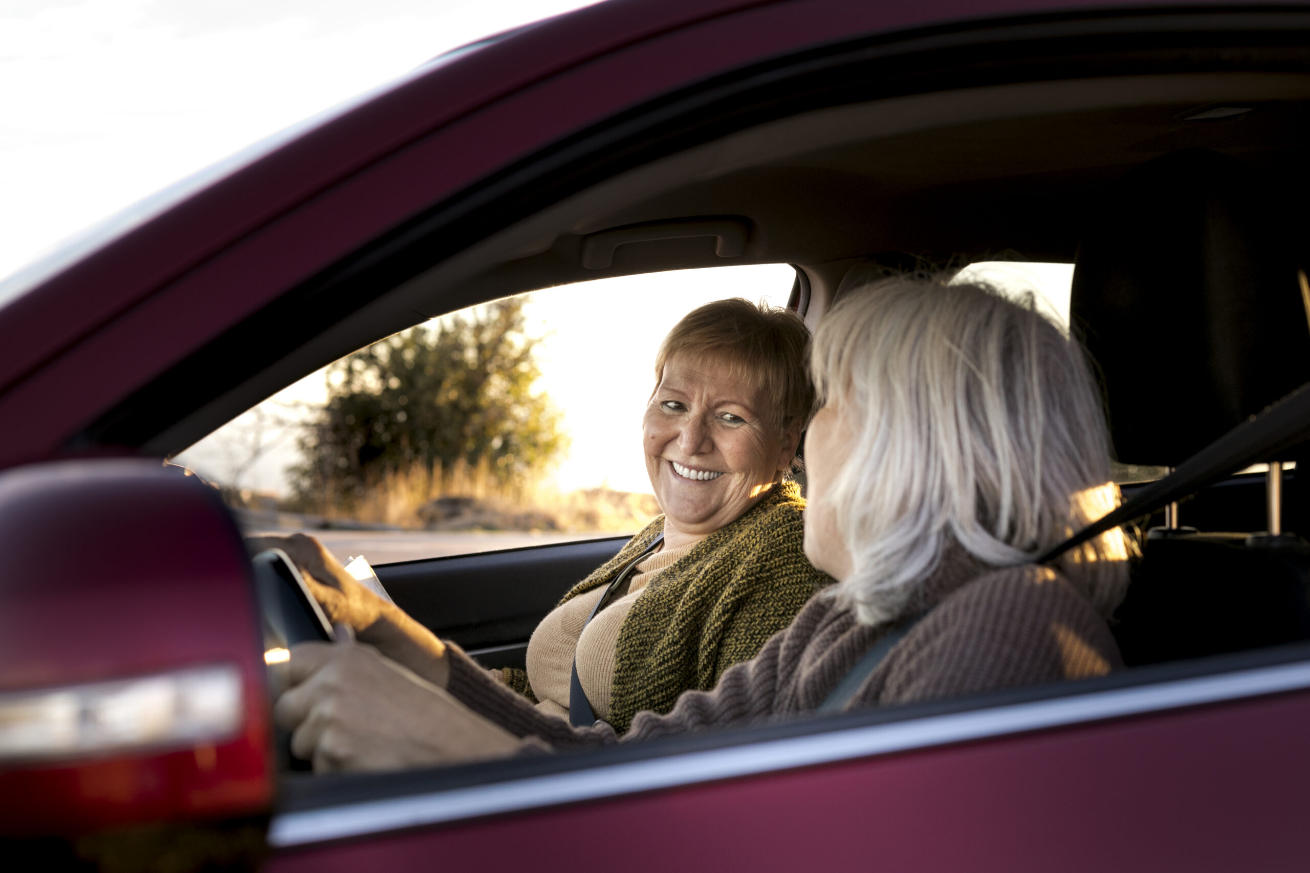 2 ladies in car, one is the medical transportation volunteer driver and the other is the client